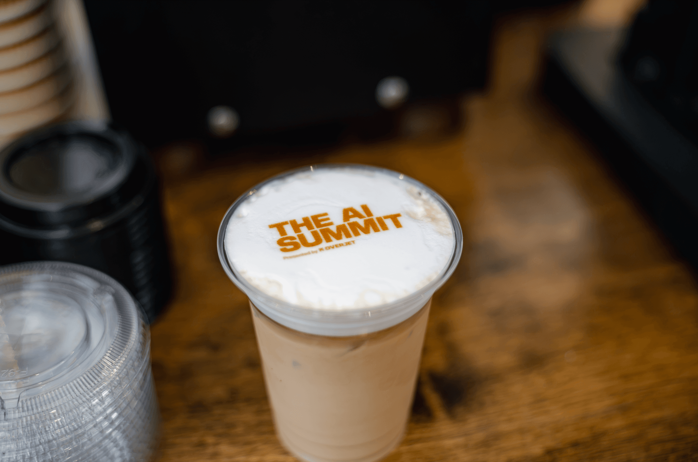 Latte with The AI Summit logo in the foam